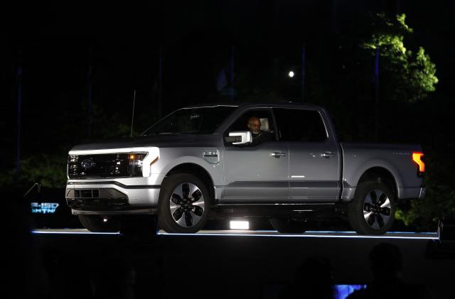 Ford Motor Company' unveils their new electric F-150 Lightning outside of their headquarters in Dearborn, Michigan on May 19, 2021. - One day after winning an enthusiastic endorsement from President Joe Biden, Ford will officially preview the all-electric version of its best-selling F-150 truck on May 19, 2021. The battery-powered Ford F-150 "Lightning" is part of the US auto giant's $22 billion campaign to ramp up its electric vehicle offerings by 2025. (Photo by JEFF KOWALSKY / AFP) (Photo by JEFF KOWALSKY/AFP via Getty Images)