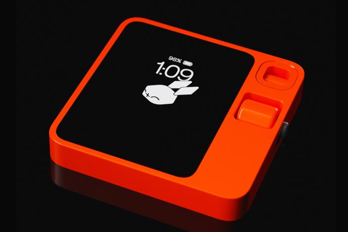 A square orange device against a black background.