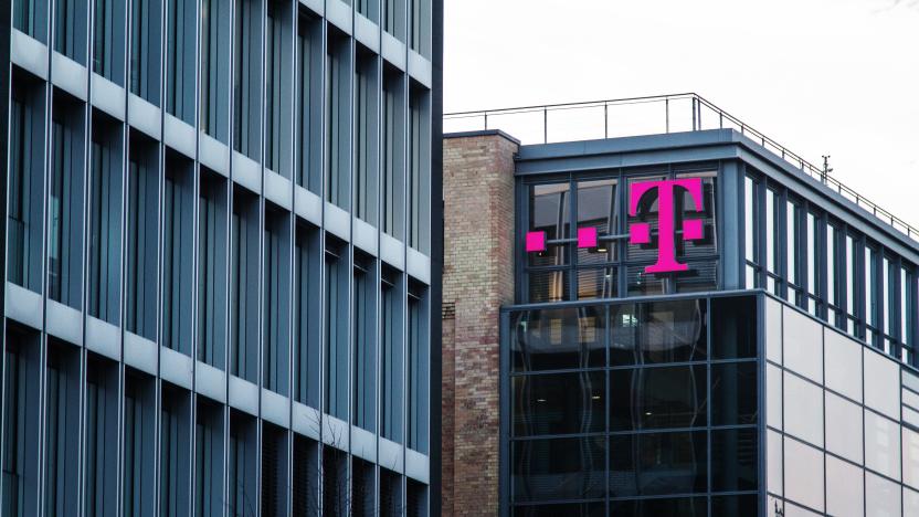 Berlin, Germany - November 27, 2014: T Mobile Sign at building in Berlin. The mobile company is primarily known with its C- network coverage available in Germany , which was shut down on 31 December 2000.
