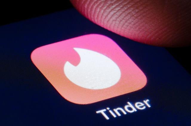 BERLIN, GERMANY - APRIL 22: The logo of mobile dating app Tinder is shown on the display of a smartphone on April 22, 2020 in Berlin, Germany. (Photo by Thomas Trutschel/Photothek via Getty Images)