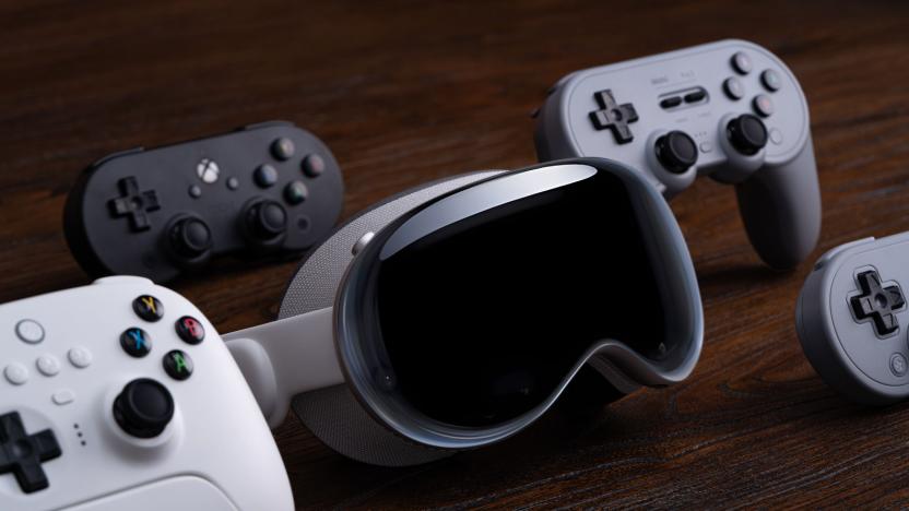 A headset next to game controllers.