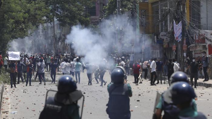 Students clash with riot police during a protest against a quota system for government jobs, in Dhaka, Bangladesh, Thursday, July 18, 2024. (AP Photo/Rajib Dhar)