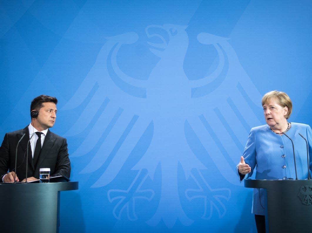 Zelenskyy invited Angela Merkel to look at mass graves in Bucha, saying they wer..