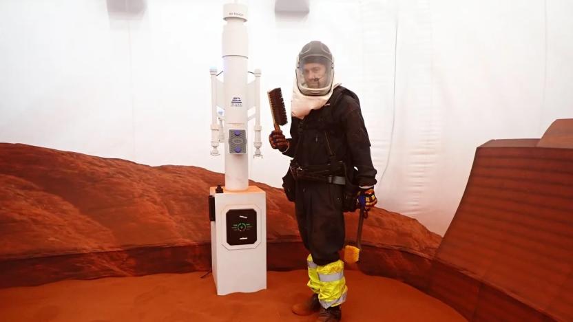 Nathan Jones stands inside the simulated Mars environment in a 1200-square-foot sandbox attached to the 3D printed habitat