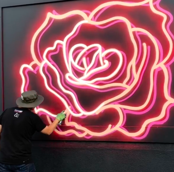 Artist creates fake neon signs with spray paint