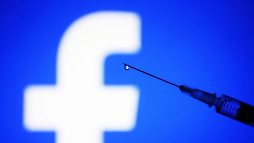 UKRAINE - 2022/02/05: In this photo illustration, a Facebook logo is seen on a smartphone screen and a medical syringe in front of it. (Photo Illustration by Pavlo Gonchar/SOPA Images/LightRocket via Getty Images)