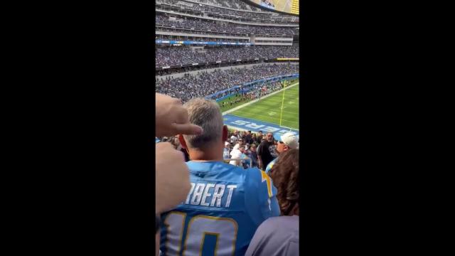 NFL fans fight at SoFi Stadium during Chargers-Raiders game