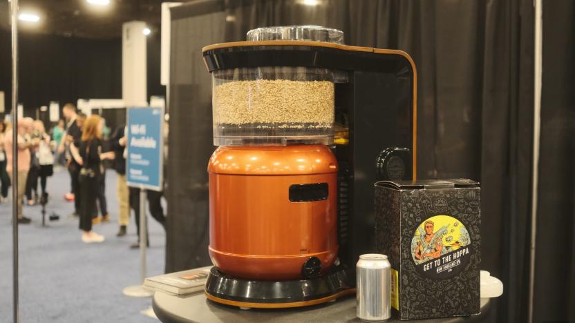 An Exobrew sitting on a messy table at CES Unveiled 2024 next to Get to the Hoppa beer.