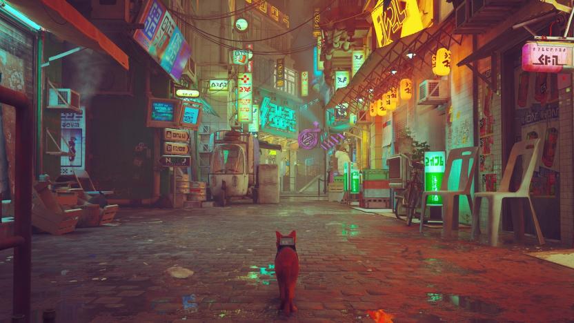 Stray's cat walks through a section of the game's post-human city, with neon lights shining in the background. 