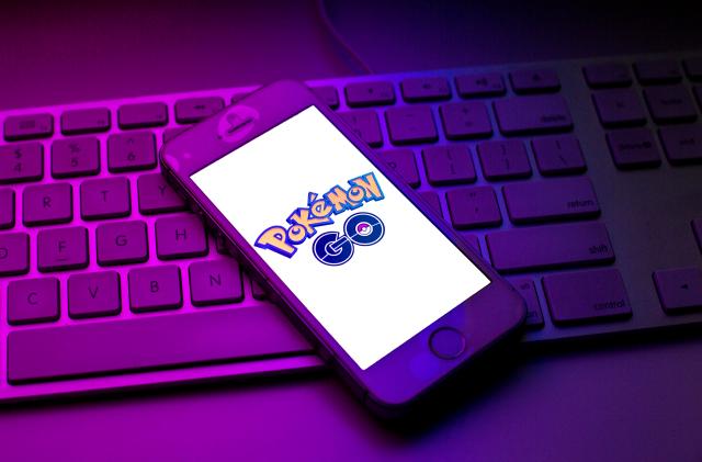 SPAIN - 2021/10/13: In this photo illustration a Pokemon GO logo seen displayed on a smartphone on top of a computer keyboard. (Photo Illustration by Thiago Prudêncio/SOPA Images/LightRocket via Getty Images)