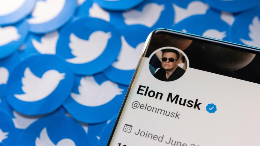 Elon Musk's Twitter profile is seen on a smartphone placed on printed Twitter logos in this picture illustration taken April 28, 2022. REUTERS/Dado Ruvic/Illustration