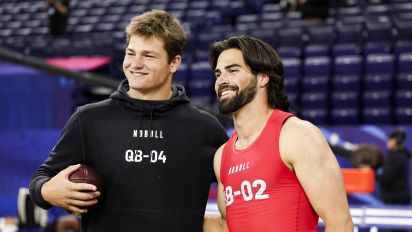 Getty Images - INDIANAPOLIS, INDIANA - MARCH 2: Drake Maye #QB04 of North Carolina takes a picture with Sam Hartman #QB02 of Notre Dame during the NFL Scouting Combine at Lucas Oil Stadium on March 2, 2024 in Indianapolis, Indiana. (Photo by Kara Durrette/Getty Images)