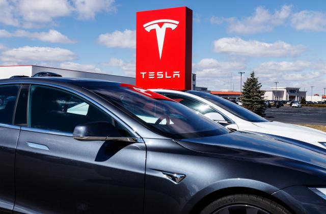 Indianapolis - Circa March 2019: Tesla Service Center. Tesla says new V3 Supercharger stations will reduce recharging times by half II