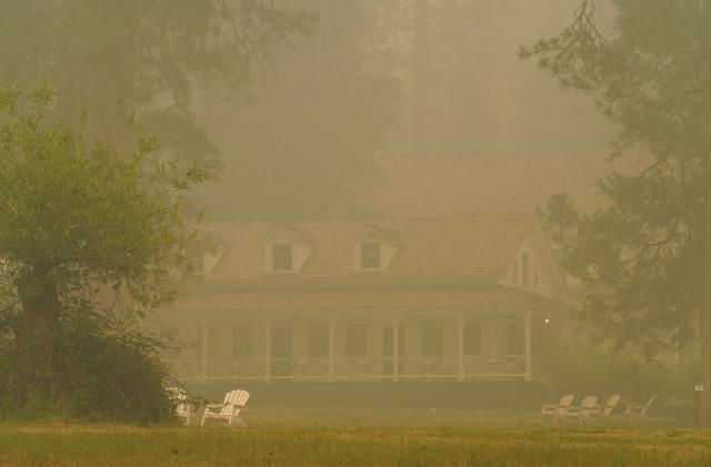 The Wawona Hotel is enshrouded in smoke from the Washburn Fire burning in Yosemite National Park near Wawona, California, U.S. July 11, 2022. The hotel was evacuated earlier in the week.  REUTERS/Tracy Barbutes