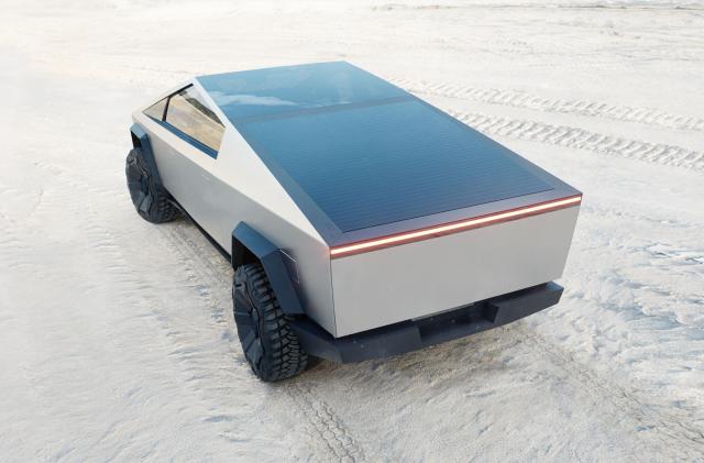 A product photo of Tesla's Cybertruck against a desert-like backdrop.