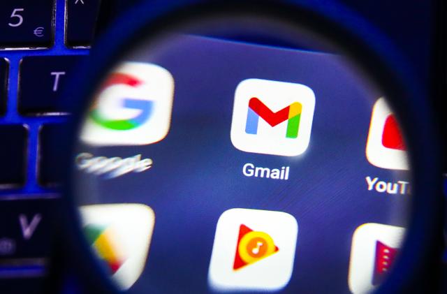 Gmail app is seen through a magnifying glass while being displayed on a mobile phone screen for illustration photo. Gliwice, Poland on January 23, 2022. (Photo by Beata Zawrzel/NurPhoto via Getty Images)