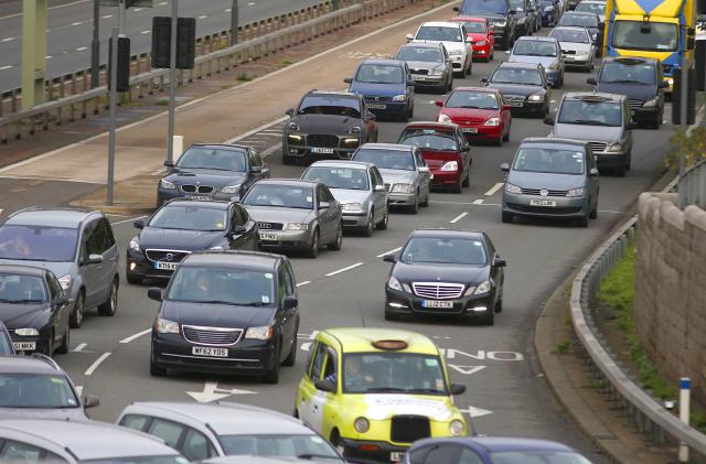 A file photograph shows a traffic jam as cars head towards the approach tunnel of Heathrow Airport, west London, Britain November 26, 2015. London transport bosses decided on Wednesday not to impose a series of strict new rules on private hire cars, including those from apps like Uber, but could make such services pay a daily charge for entering the city centre.  REUTERS/Peter Nicholls/files - LR1EC1K168NYM
