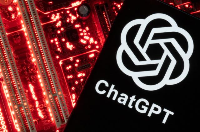 A smartphone with a displayed ChatGPT logo is placed on a computer motherboard in this illustration taken February 23, 2023. REUTERS/Dado Ruvic/Illustration