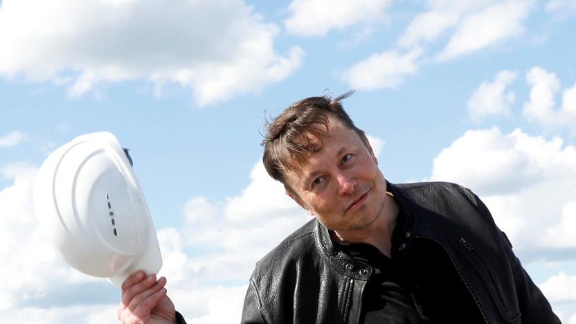 SpaceX founder and Tesla CEO Elon Musk holds a helmet as he visits the construction site of Tesla's gigafactory in Gruenheide, near Berlin, Germany, May 17, 2021. REUTERS/Michele Tantussi