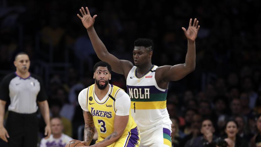 Los Angeles Lakers' Anthony Davis (3) is defended by New Orleans Pelicans' Zion Williamson (1) during the second half of an NBA basketball game Tuesday, Feb. 25, 2020, in Los Angeles. (AP Photo/Marcio Jose Sanchez)