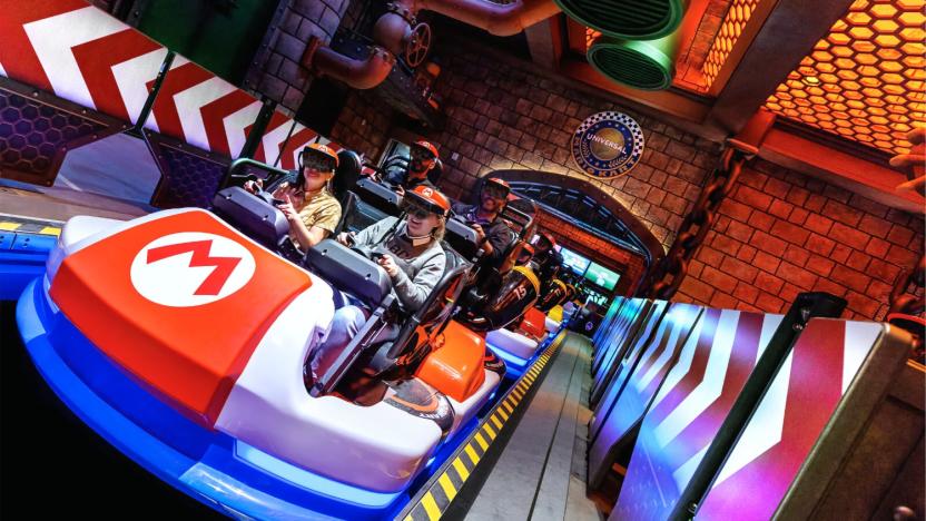 Park patrons wear augmented reality headsets and ride go-karts at Universal Studios Hollywood.