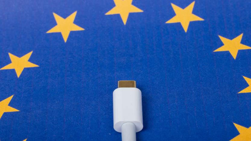 Concept for EU law to force USB-C chargers for all phones. EUROPEAN UNION flag and USBC universal charging cable as a standard for small electronic devices