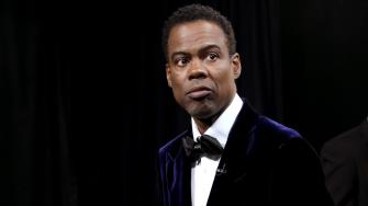 Chris Rock said he won't speak on controversial Oscars slap 'until I get paid,' report says