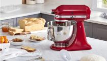 KitchenAid Artisan Stand Mixer and various breads on a countertop.
