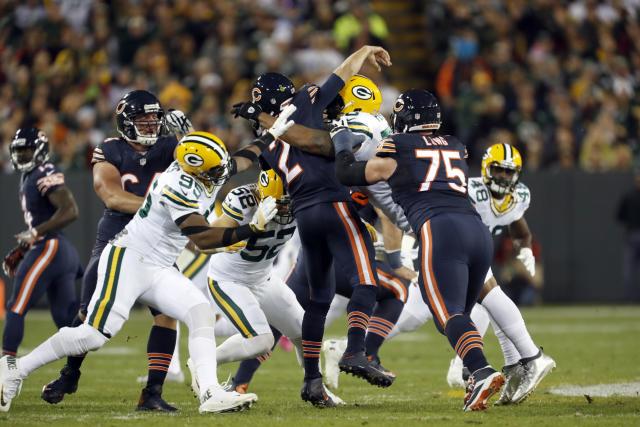 Ouch: Packers Clay Matthews and Julius Peppers crush Bears QB Brian Hoyer; the play broke Hoyer's left arm. (AP)