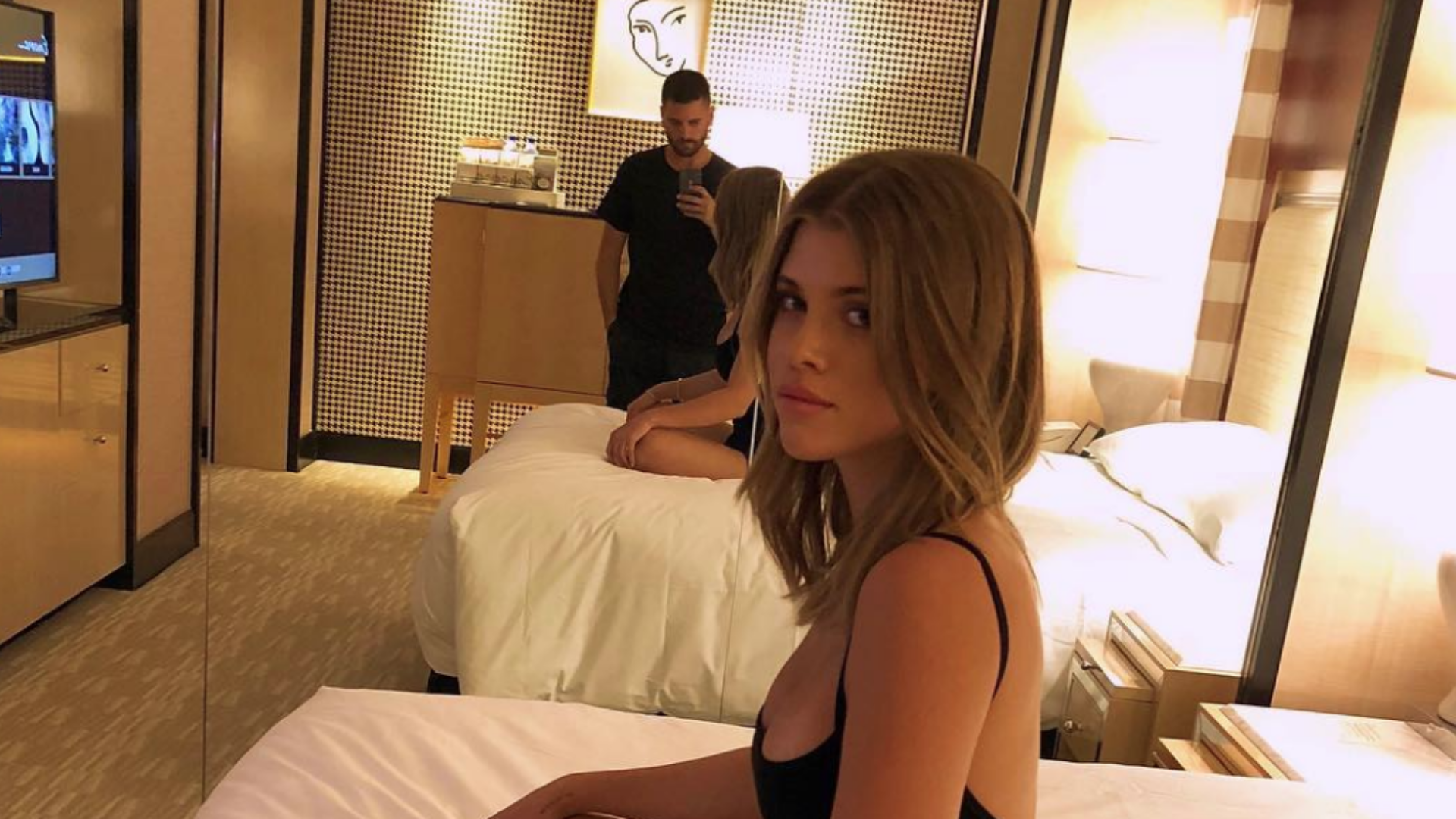 Sofia Richie, wearing FREECITY Sparrow Let's Go Sweatpants and a Chanel  backpack, and her boyfriend go