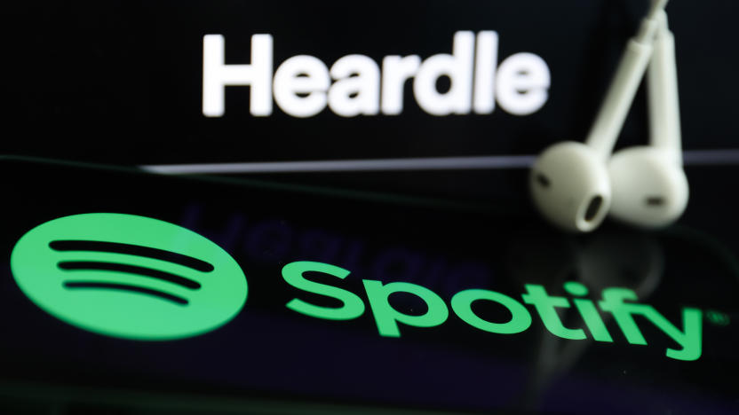 Heardle logo displayed on a laptop screen, Spotify logo displayed on a phone screen and headphones are seen in this illustration photo taken in Krakow, Poland on July 12, 2022. (Photo by Jakub Porzycki/NurPhoto via Getty Images)