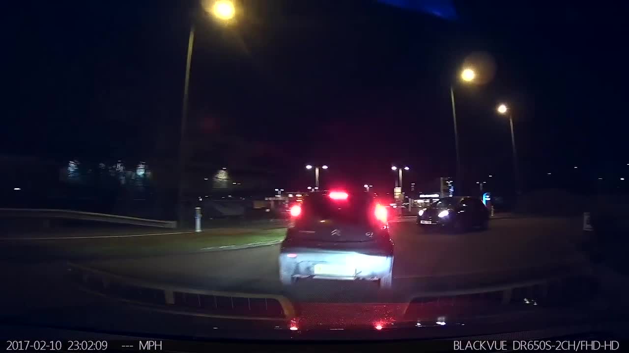 Car Travels The Wrong Way Around A Roundabout