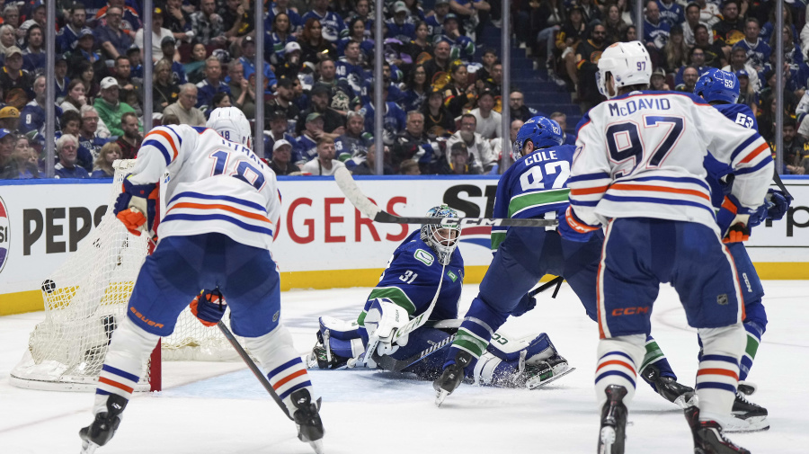 Associated Press - Evan Bouchard scored 5:38 into overtime and the Edmonton Oilers beat the Vancouver Canucks 4-3 on Friday night to even their second-round playoff series at one game apiece.  Leon