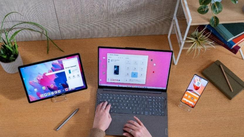 A Lenovo ThinkPad next to a tablet and smartphone. 