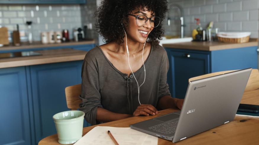 Photo of a woman using Acer's Chromebook Spin 714 laptop.