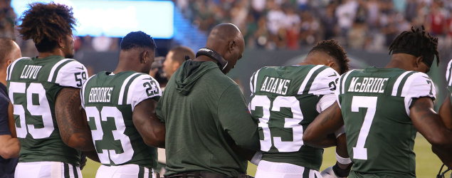 Members of the New York Jets lock arms during the national anthem during last week’s preseason game. (Getty Images)