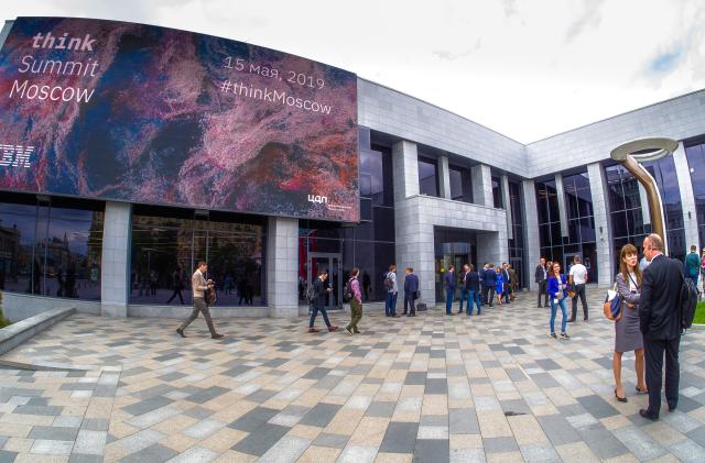 Moscow, Russia - May 15, 2019: Participants of the IBM think Summit conference stand at the main entrance to the Digital Business Space congress center in Moscow, Russia on May 15, 2019.