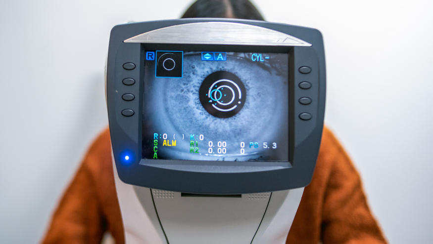 A Women having an eye exam at ophthalmologist's office.