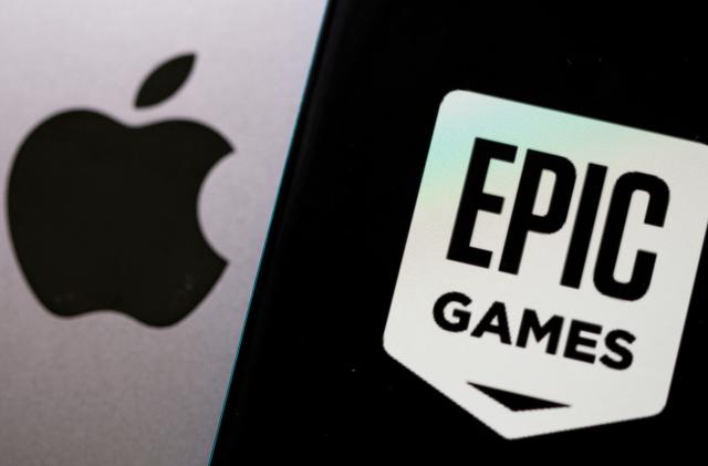 FILE PHOTO: Smartphone with Epic Games logo is seen in front of Apple logo in this illustration taken, May 2, 2021. REUTERS/Dado Ruvic/Illustration/File Photo