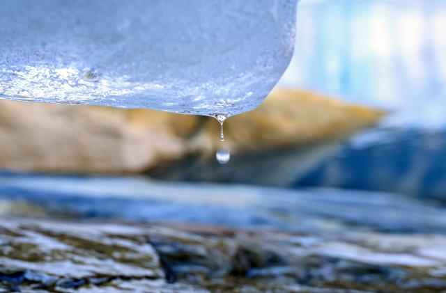 Water drips from a section of the melting Grinnell Glacier in Glacier National Park, Montana, on October 19, 2023. (Photo by JOSH EDELSON / AFP) (Photo by JOSH EDELSON/AFP via Getty Images)