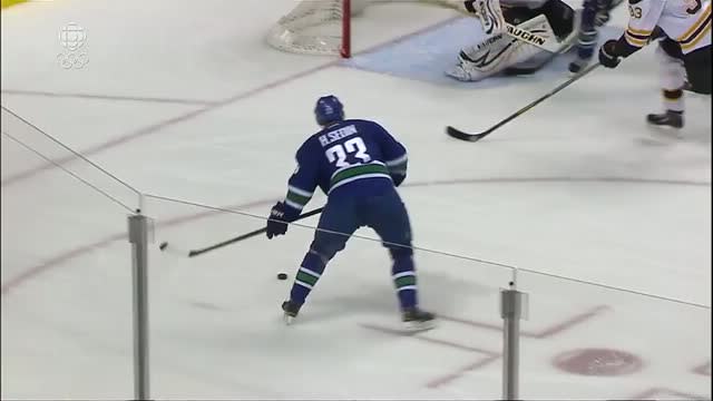 Henrik Sedin scores on pass from Daniel Sedin