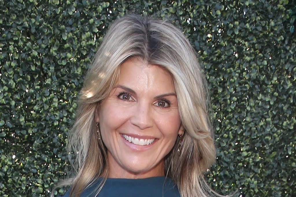 Lori Loughlin stepped out in a navy dress and gold glitter-heeled ...