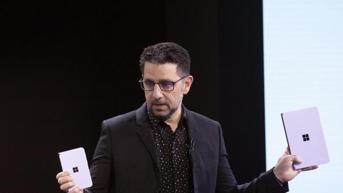 FILE - Microsoft's Chief Product Officer Panos Panay holds a Surface Duo, left, and Surface Neo at an event, Wednesday, Oct. 2, 2019, in New York. Panos Panay is stepping down after nearly 20 years at Microsoft, according to a staff memo Monday, Sept. 18, 2023. (AP Photo/Mark Lennihan, File)