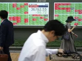 Asian markets trade mixed after Wall Street climbs closer to its record high