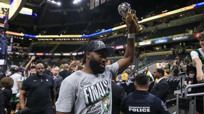 Getty Images - INDIANAPOLIS, INDIANA - MAY 27: Jaylen Brown #7 of the Boston Celtics raises The Larry Bird Trophy after winning Game Four of the Eastern Conference Finals at Gainbridge Fieldhouse on May 27, 2024 in Indianapolis, Indiana. NOTE TO USER: User expressly acknowledges and agrees that, by downloading and or using this photograph, User is consenting to the terms and conditions of the Getty Images License Agreement. (Photo by Justin Casterline/Getty Images)