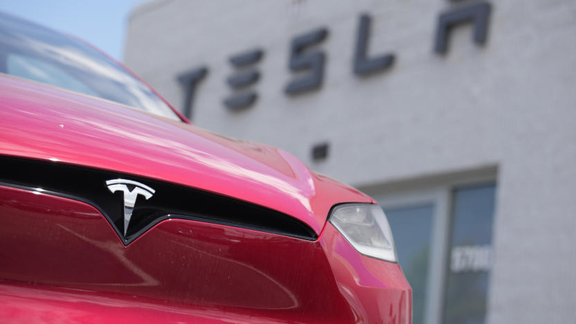 FILE - An unsold 2023 Model X sports-utility vehicle sits outside a Tesla dealership Sunday, June 18, 2023, in Littleton, Colo. After enjoying a strong run where they could keep raising prices to boost their profits, companies are now stuck in a vise. On one end, revenue is under pressure as the global economy remains fragile. On the other, companies are having to pay higher wages for workers, among other costs. Caught in the middle are corporate profit margins, which measure how much profit companies make on each $1 of revenue. (AP Photo/David Zalubowski, File)