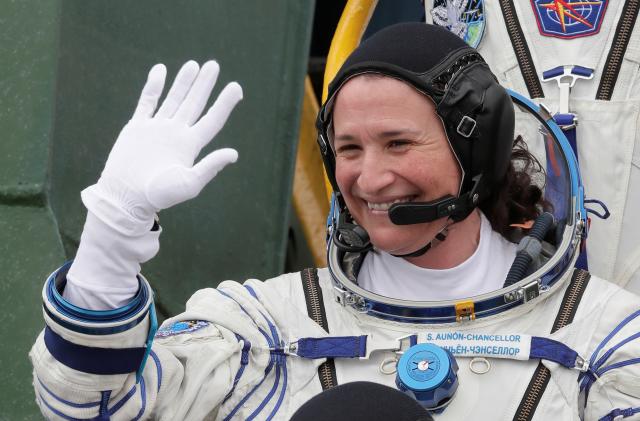 International Space Station (ISS) crew member Serena Aunon-Chancellor of the U.S waves as she boards the Soyuz MS-09 spacecraft for the launch at the Baikonur Cosmodrome, Kazakhstan June 6, 2018.  Dmitri Lovetsky/Pool via REUTERS
