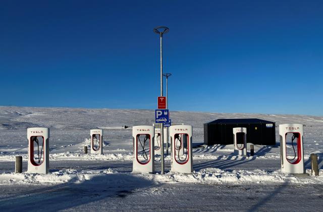 Tesla electric vehicles chargers are seen in a petrol station on King road during the winter in Staour, Iceland February 12, 2022. Picture taken February 12, 2022. REUTERS/Nacho Doce