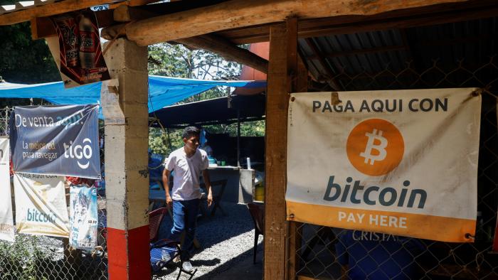 Bitcoin banners are seen outside of a small restaurant at El Zonte Beach in Chiltiupan, El Salvador June 8, 2021. REUTERS/Jose Cabezas