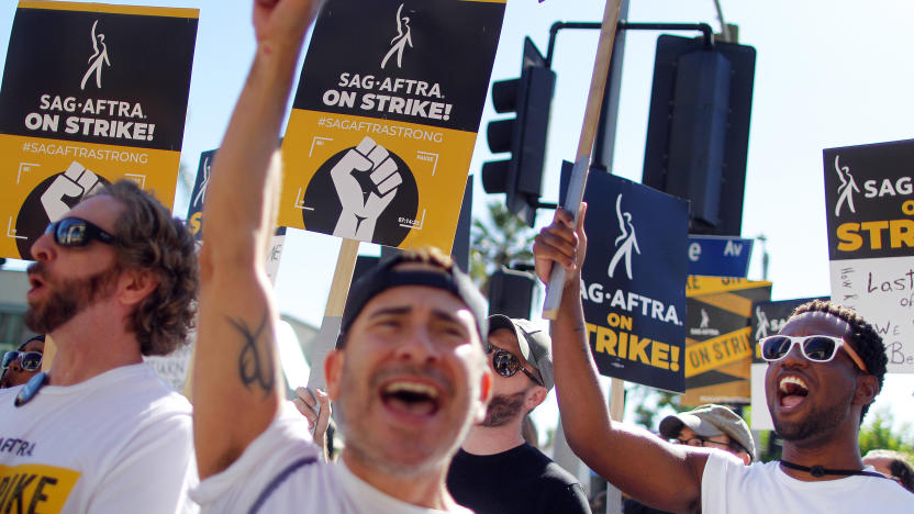 LOS ANGELES, CALIFORNIA - NOVEMBER 08: SAG-AFTRA members and supporters chant outside Paramount Studios on day 118 of their strike against the Hollywood studios on November 8, 2023 in Los Angeles, California. A tentative labor agreement has been reached between the actors union and the Alliance of Motion Picture and Television Producers (AMPTP) with the strike set to end after midnight. (Photo by Mario Tama/Getty Images)